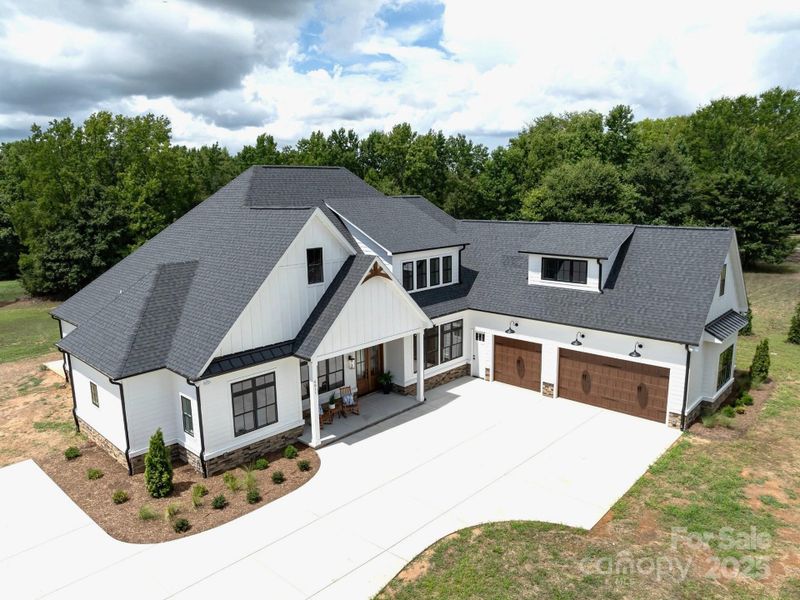 Front exterior of a new home in , Waxhaw, NC, highlighting curb appeal (Image 2). Front exterior of a new home in , Waxhaw, NC, highlighting curb appeal (Image 2).