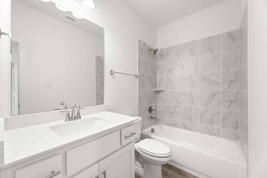 Representative furnished interior of a home built from the Blackburn by UnionMain Homes in Reunion, Rhome (Image 5).