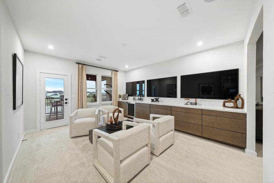 Large game room and media room off the balcony. Representative image.