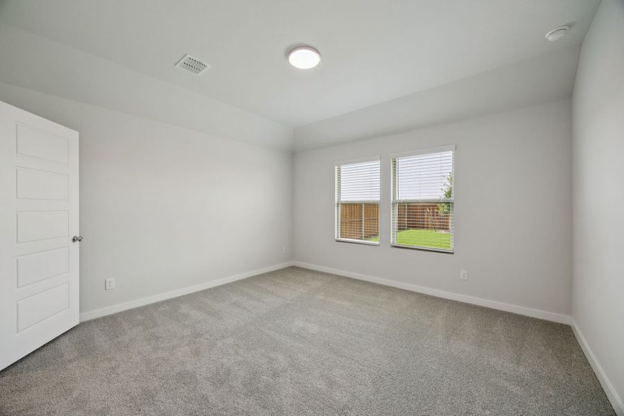 Primary Suite in the Hadley home plan by Trophy Signature Homes – REPRESENTATIVE PHOTO