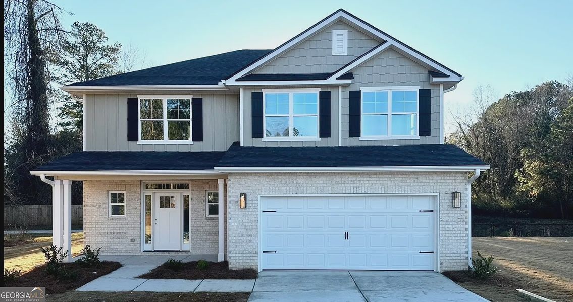 Front exterior of a new home in Canterbury Villas, Carrollton, GA, highlighting curb appeal (Image 1). Front exterior of a new home in Canterbury Villas, Carrollton, GA, highlighting curb appeal (Image 1).