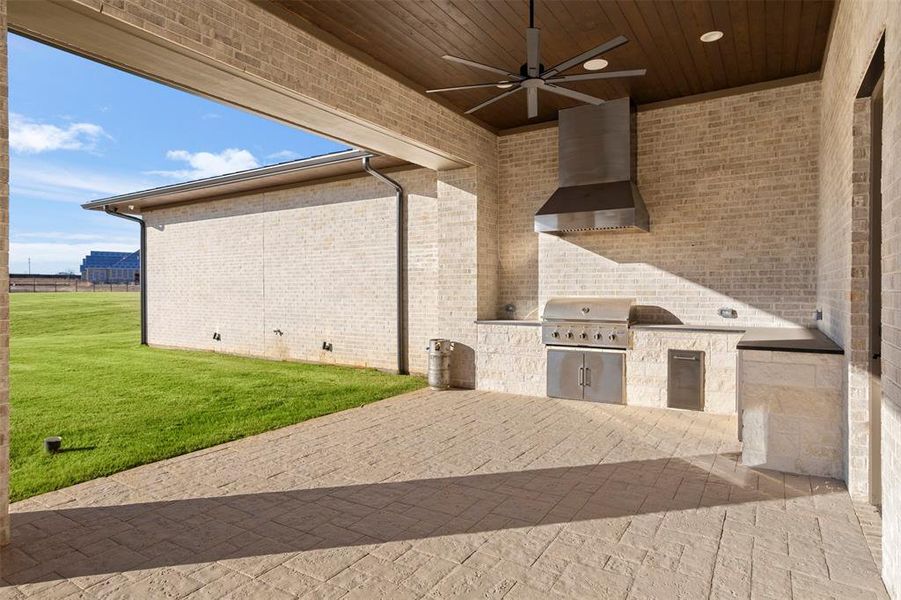 Outdoor kitchen off another oversized covered patio.  Prepped for screens if desired but not included currently. See feature list.
