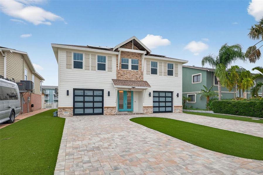Front exterior of a new home in , Indian Rocks Beach, FL, highlighting curb appeal (Image 28).