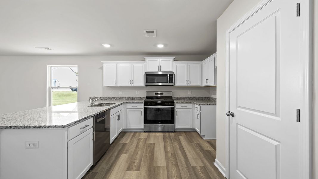 Furnished interior view inside a new home in Village Grove, Greenville (Image 8).