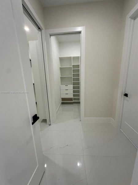 Hallway to 2 Walk-in Closet and Master Bathroom