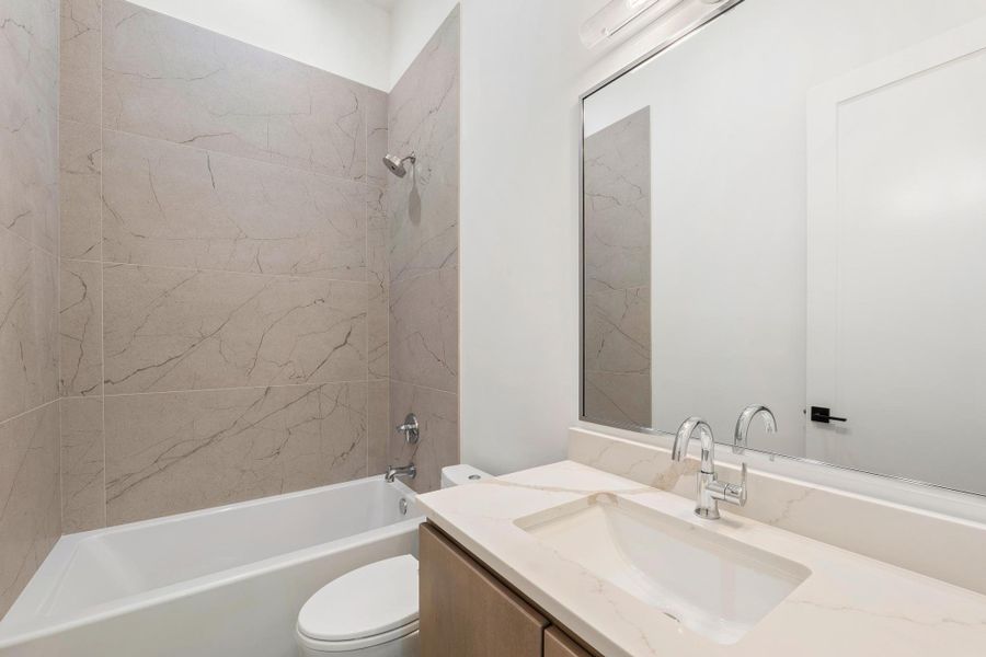 Full bath with vanity and tub / shower combination