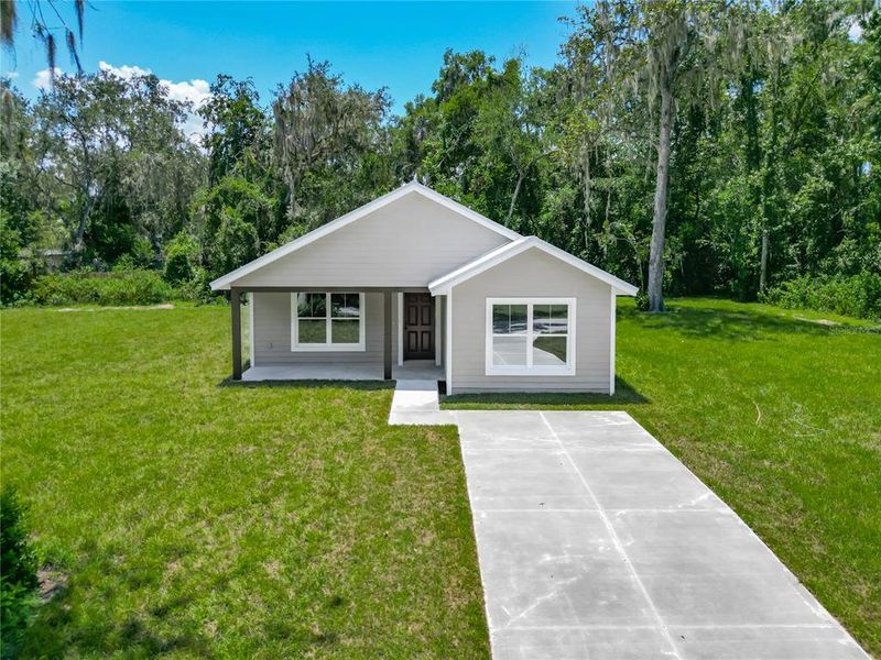 Front exterior of a new home in , Lake Panasoffkee, FL, highlighting curb appeal (Image 22).