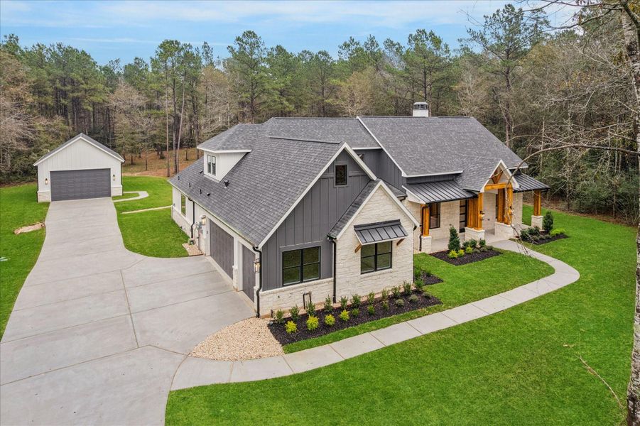 Front exterior of a new home in , Huntsville, TX, highlighting curb appeal (Image 20). Front exterior of a new home in , Huntsville, TX, highlighting curb appeal (Image 20).