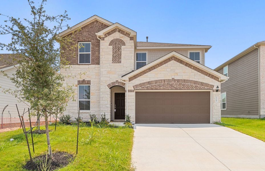 Front exterior of a new home in Patterson Ranch, Georgetown, TX, highlighting curb appeal (Image 20).