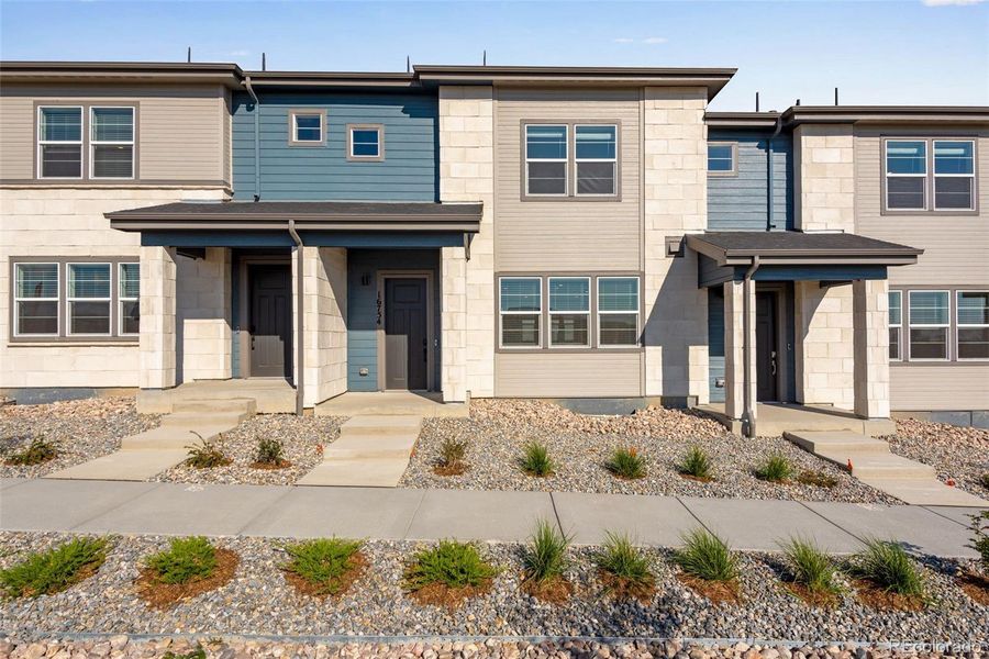 Front exterior of a new home in , Arvada, CO, highlighting curb appeal (Image 2).