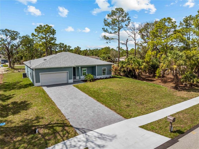 Front exterior of a new home in , North Port, FL, highlighting curb appeal (Image 20).