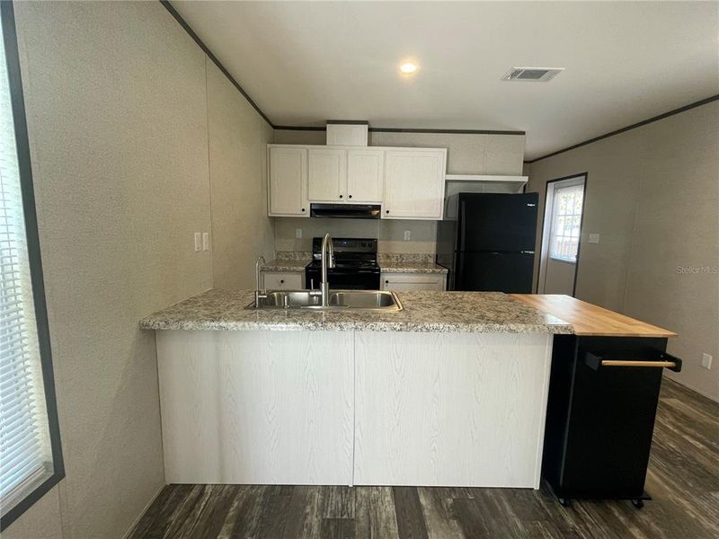 Furnished interior view inside a new home in , Dunnellon (Image 4).