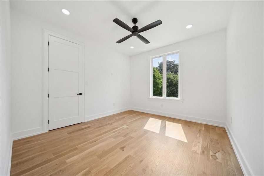 Bedroom featuring light hardwood flooring and ceiling fan