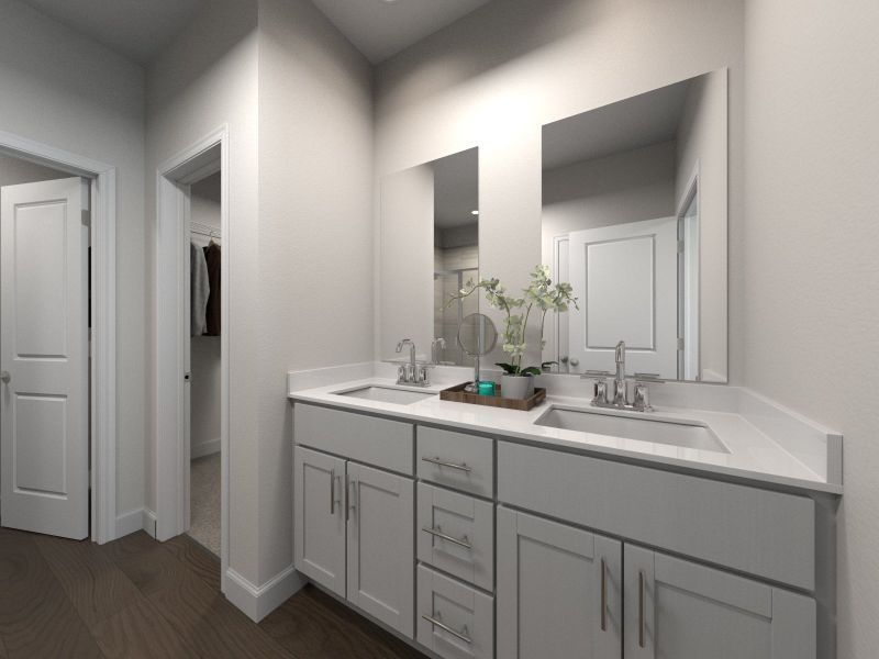 The primary bathroom offers dual vanity sinks and a walk-in closet.