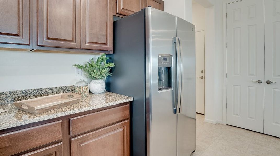 Kitchen fridge and cabnitry