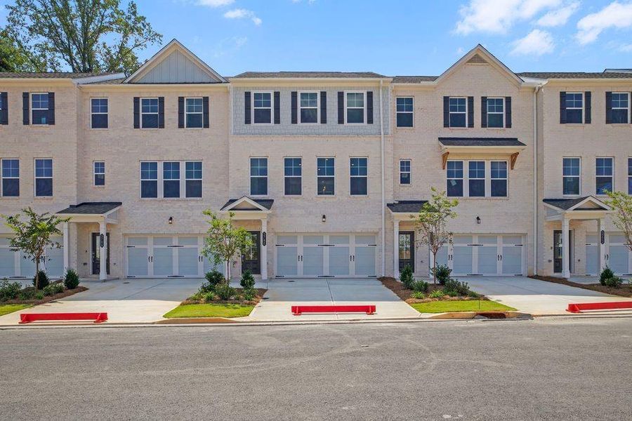 Front exterior of a new home in Somerset at Veterans Memorial, Mableton, GA, highlighting curb appeal (Image 1).