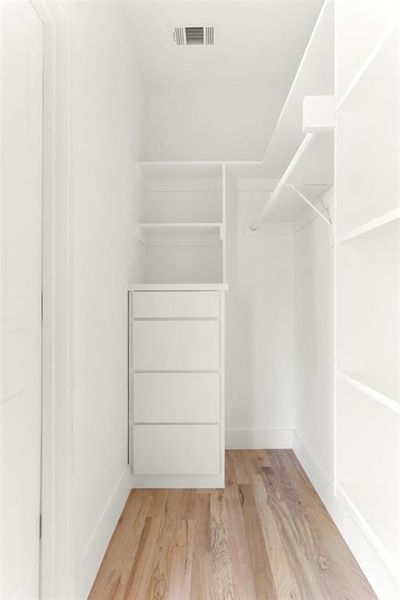 Walk in closet featuring light hardwood / wood-style floors