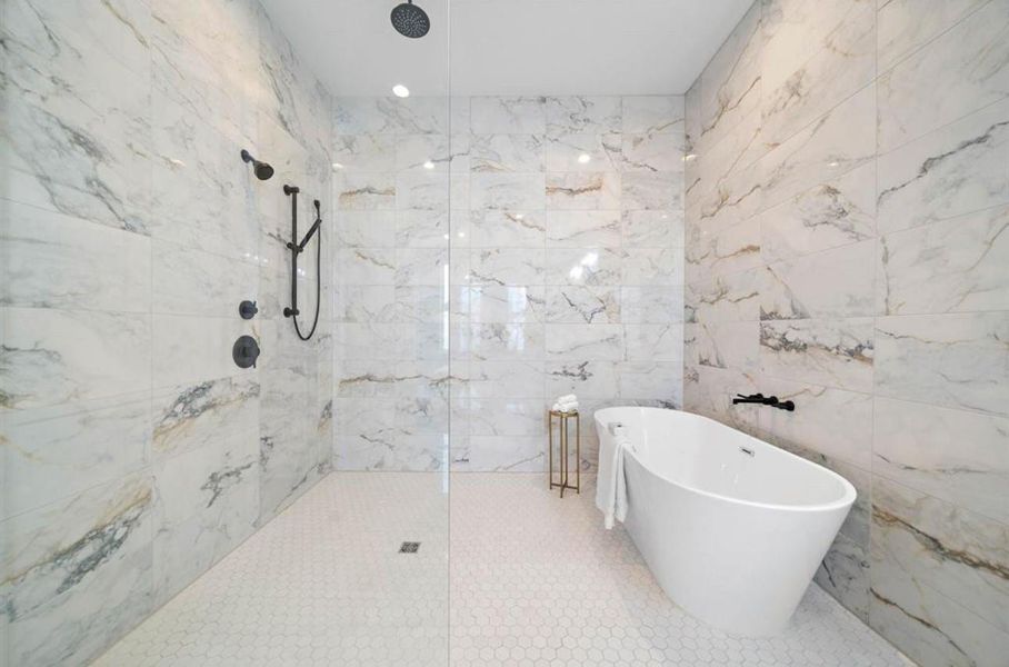 A look inside Riverway’s signature “super showers,” designed to impress and elevate the bathing experience.Photos depict a completed Riverway Home; this home is under construction and finishes may vary.