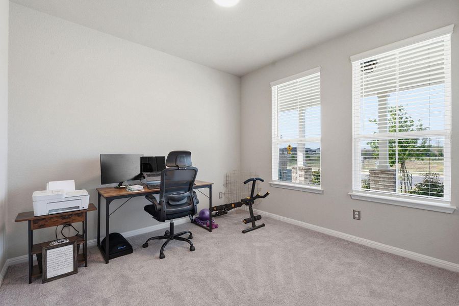 Office featuring light carpet and baseboards Office featuring light carpet and baseboards