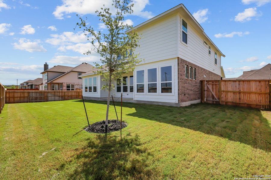 Front exterior of a new home in Megan's Landing 50', Castroville, TX, highlighting curb appeal (Image 18).