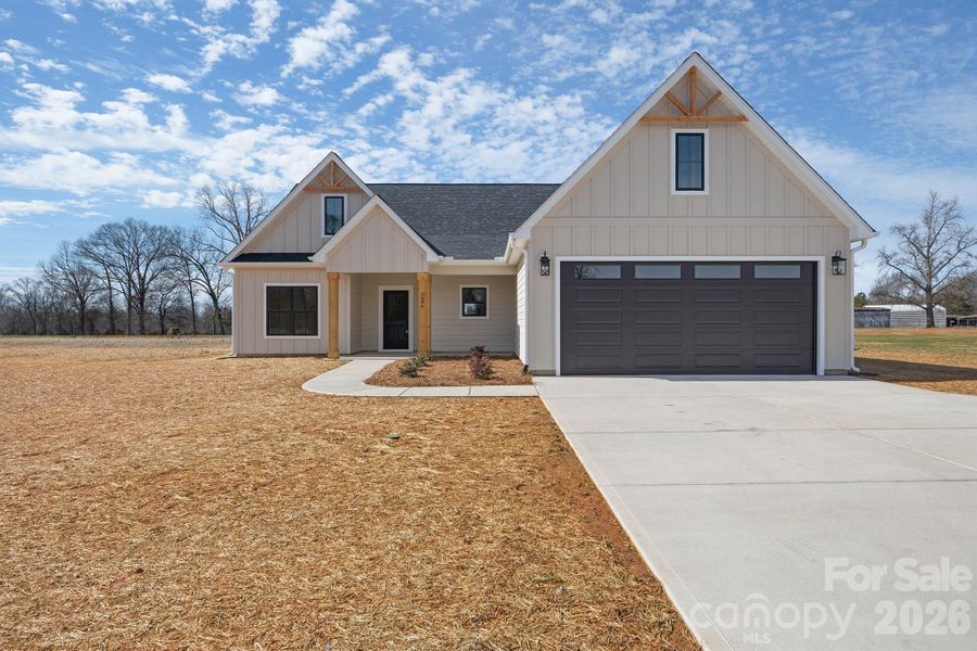 Front exterior of a new home in , Crouse, NC, highlighting curb appeal (Image 21).