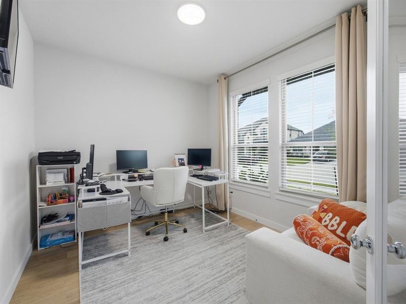 Office space featuring light wood finished floors