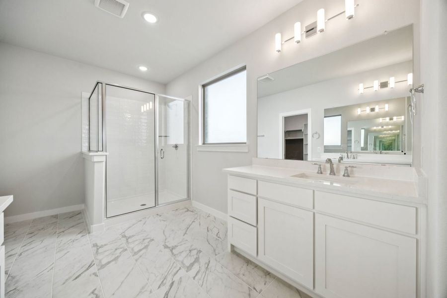 Primary Bathroom in the Wimbledon home plan by Trophy Signature Homes – REPRESENTATIVE PHOTO