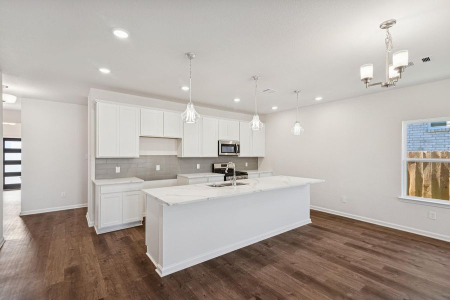 The Crawford- Kitchen. Home under construction, photo used for illustrative purposes only, colors and options will vary.