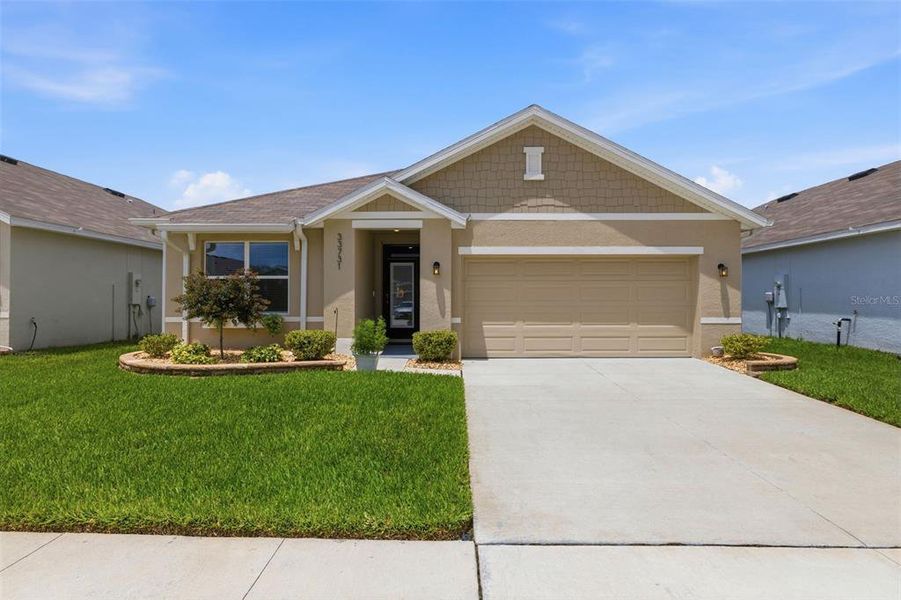 Front exterior of a new home in , Wesley Chapel, FL, highlighting curb appeal (Image 24). Front exterior of a new home in , Wesley Chapel, FL, highlighting curb appeal (Image 24).