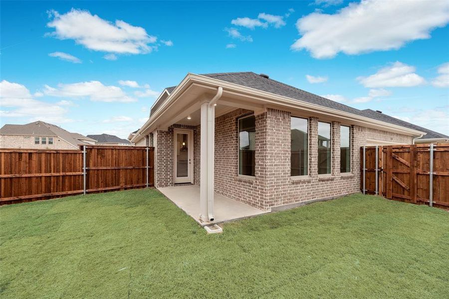 Exterior details and patio area of a home in Villages of Creekwood, Frisco (Image 18).