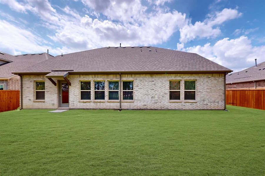 Front exterior of a new home in The Preserve, Justin, TX, highlighting curb appeal (Image 18).
