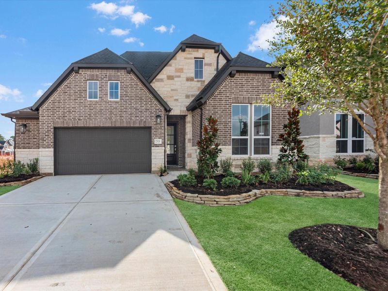 Front exterior of a new home in Oakhill Reserve, Tomball, TX, highlighting curb appeal (Image 2). Front exterior of a new home in Oakhill Reserve, Tomball, TX, highlighting curb appeal (Image 2).