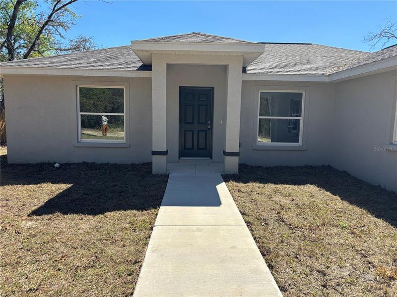 Exterior details and patio area of a home in , Citrus Springs (Image 24).