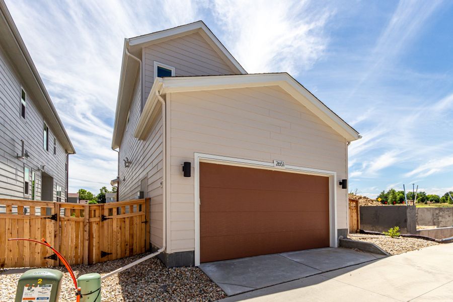 Front exterior of a new home in Arras Park, Thornton, CO, highlighting curb appeal (Image 27).