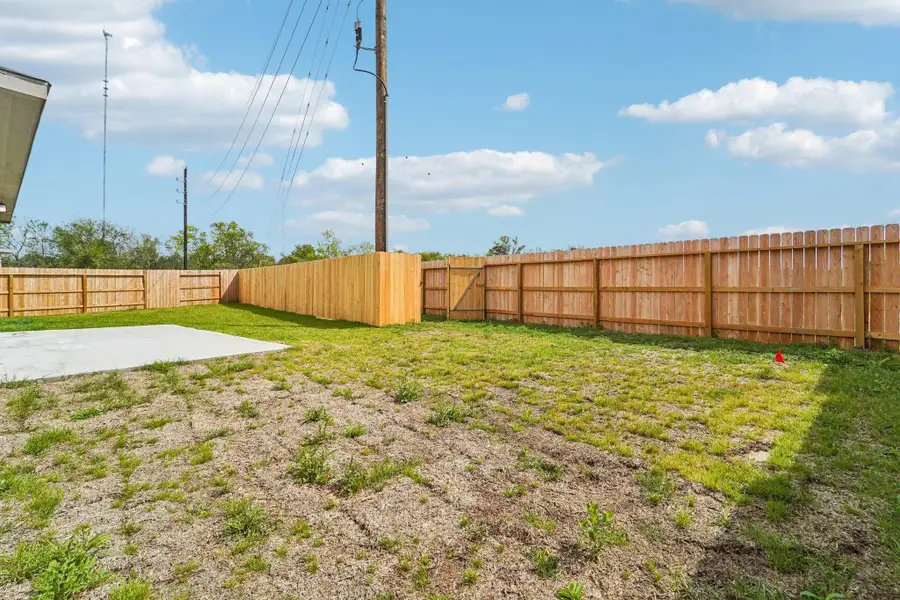Views of the backyard green space and fully fenced yard.