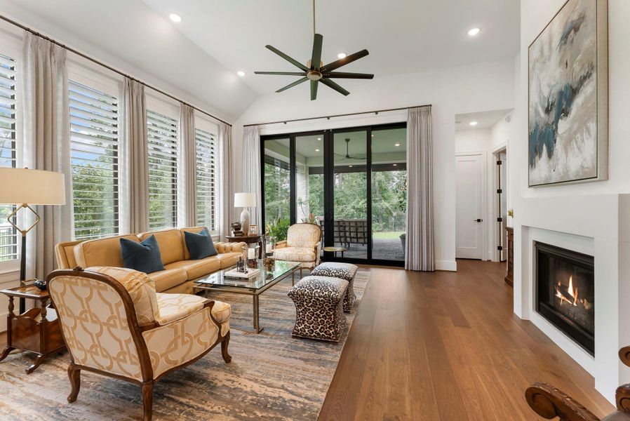 Another stunning view of the living room balances openness and intimacy with backyard views.