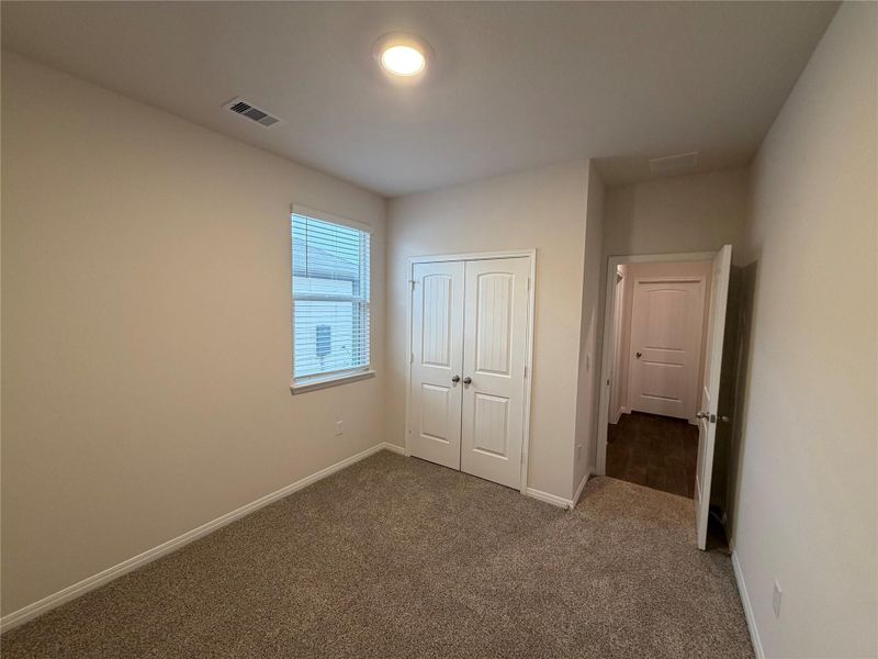 Unfurnished bedroom with carpet floors and a closet