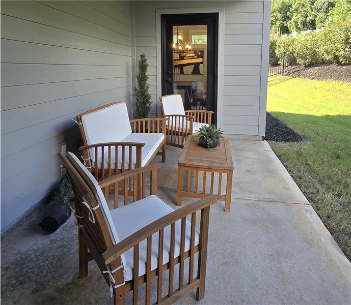 An inviting outdoor patio offers a comfortable are An inviting outdoor patio offers a comfortable are