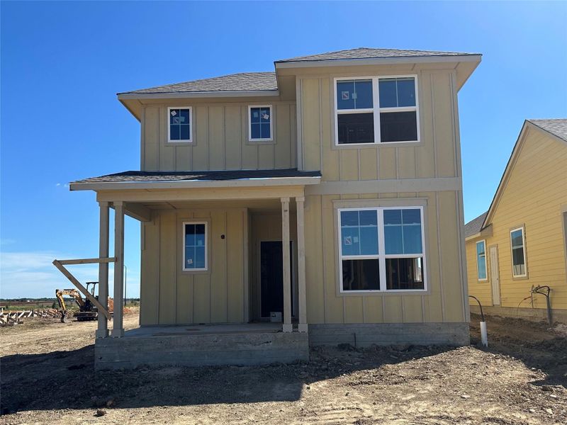Front exterior of a new home in Harvest Ridge, Elgin, TX, highlighting curb appeal (Image 2). Front exterior of a new home in Harvest Ridge, Elgin, TX, highlighting curb appeal (Image 2).