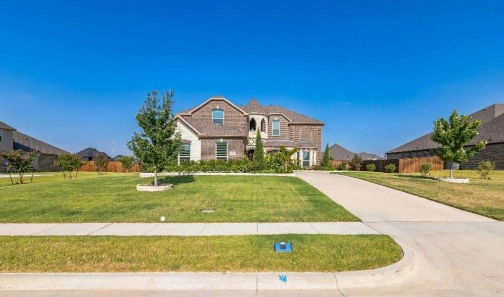 View of front of property with a front yard