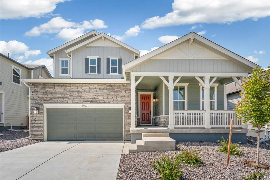 Front exterior of a new home in Turnberry, Commerce City, CO, highlighting curb appeal (Image 2).