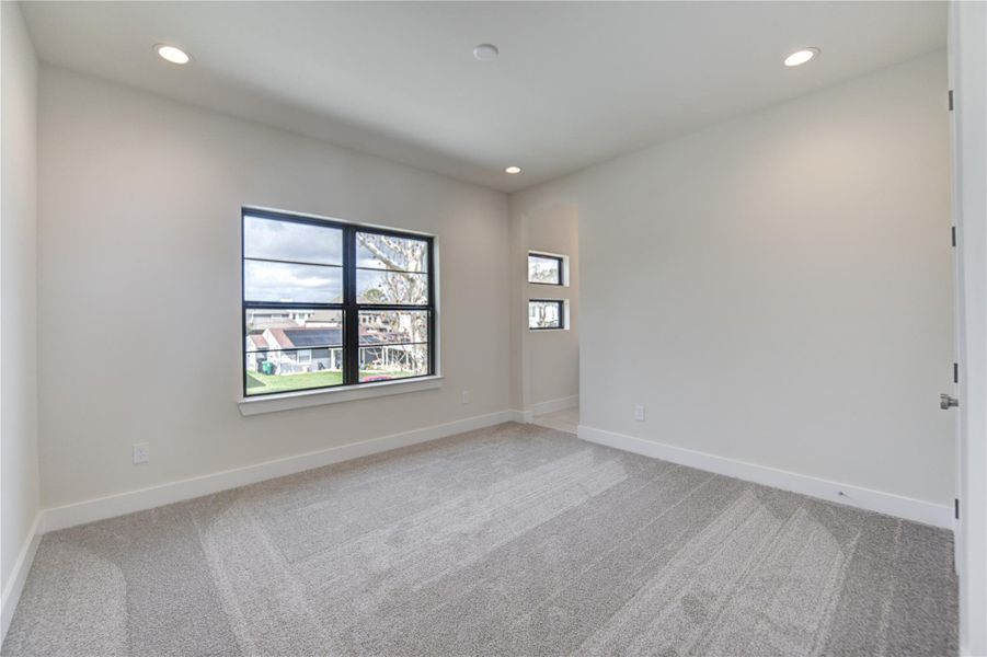 One of the three secondary bedrooms on the second floor. One of the three secondary bedrooms on the second floor.