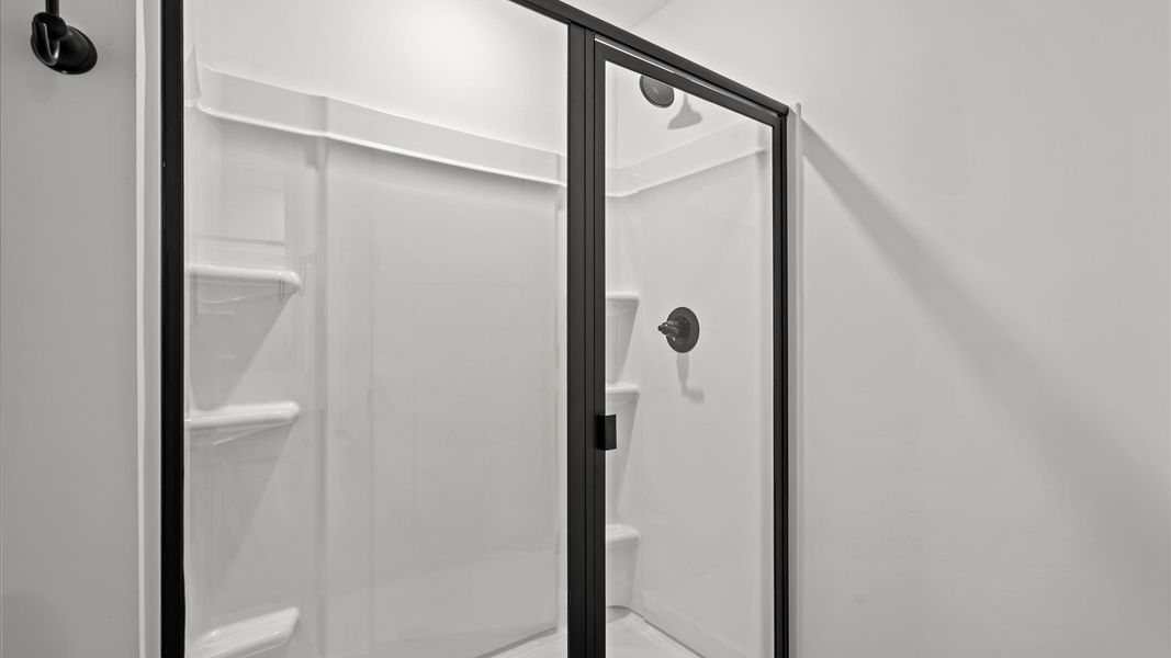 Superior en-suite primary bathroom with stylish dual vanity and walk-in shower crafted with high standards in mind