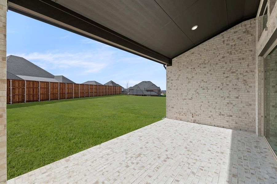 Exterior details and patio area of a home in Cambridge Estates - Harwood, Prosper (Image 4).