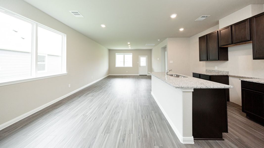 Kitchen and Dining Area to Family Room
