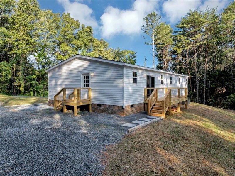 Front exterior of a new home in , Waleska, GA, highlighting curb appeal (Image 2).