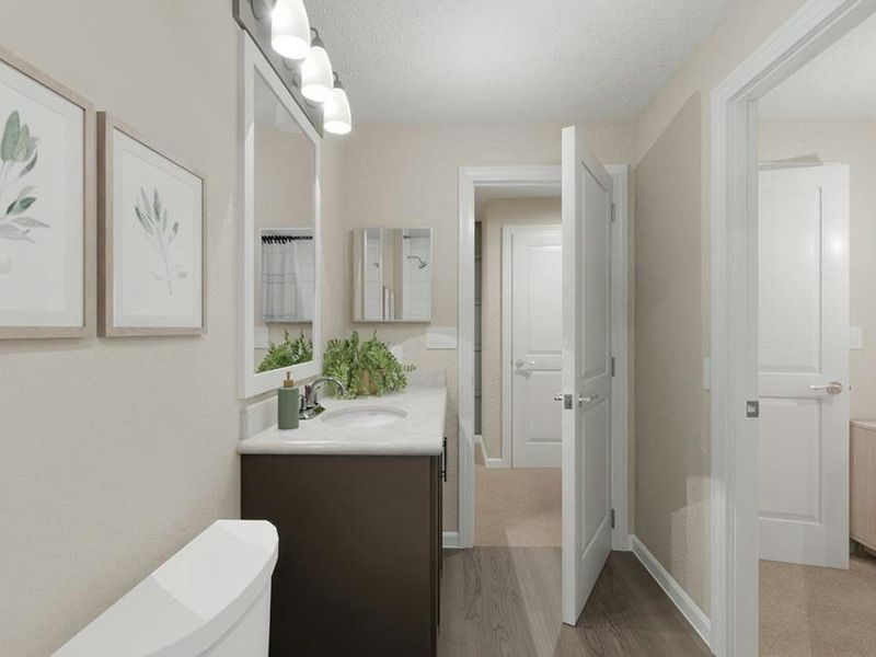 Bedroom 4 and the loft share an upstairs hall bath, and a convenient powder room is located downstairs.