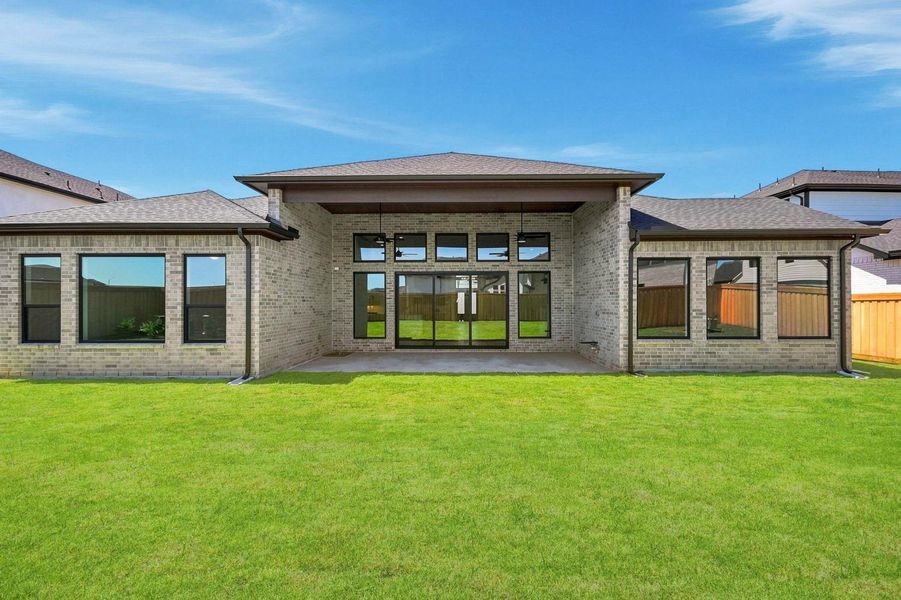 Exterior details and patio area of a home in Dunham Pointe 70', Cypress (Image 15).