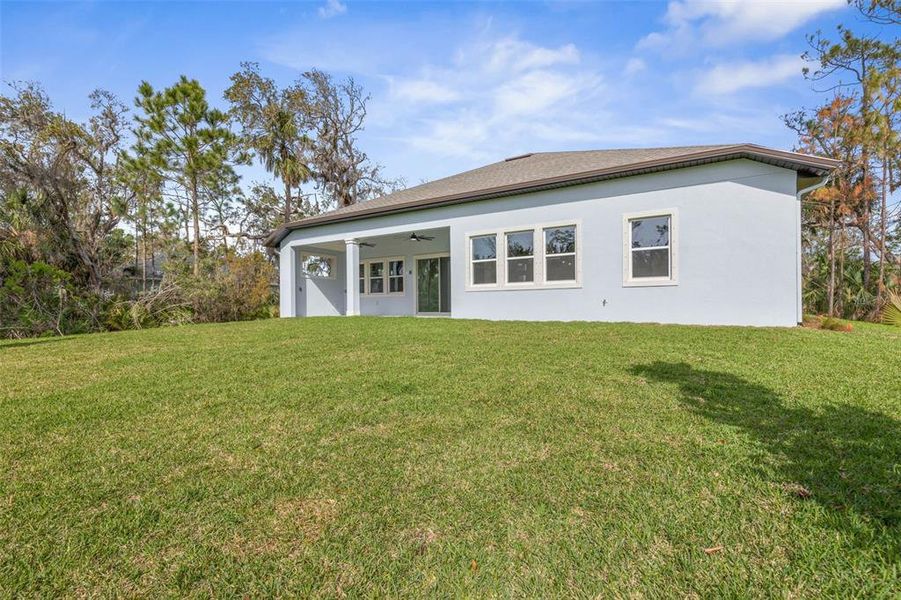 Exterior details and patio area of a home in Palm Coast Plantation, Palm Coast (Image 28).