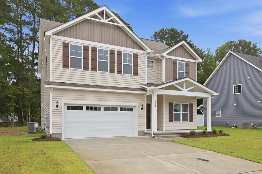 Front exterior of a new home in Davenport Farms, Winterville, NC, highlighting curb appeal (Image 2). Front exterior of a new home in Davenport Farms, Winterville, NC, highlighting curb appeal (Image 2).